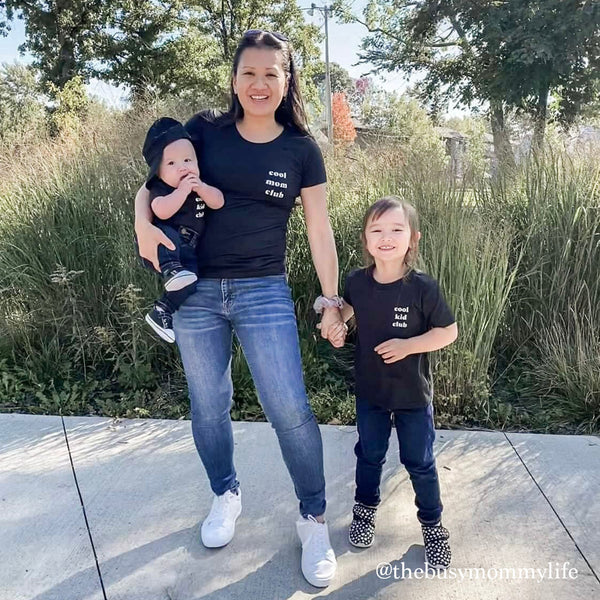 mom and children in matching shirts
