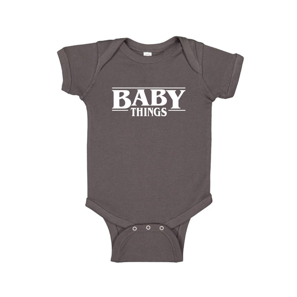 charcoal onesie that says "baby things"